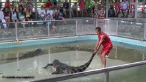 Man puts his head inside crocodile's jaw, kisses crocodile, eats crocodile slime