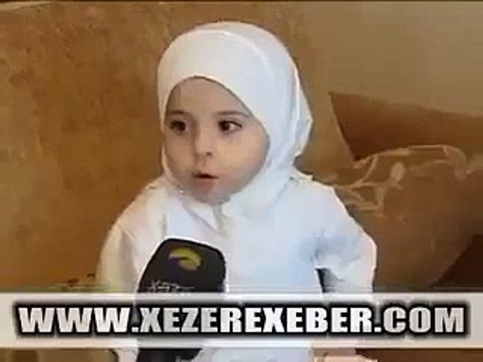 A Very Cute And Small Baby Reciting Quran