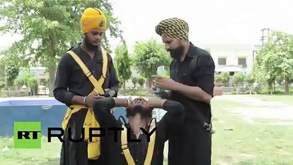 India- Blindfold Sikh daredevils slash each other with swords