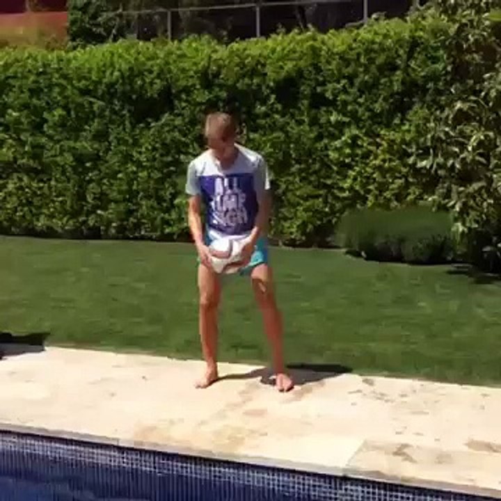 Real Madrid teenager Martin Odegaard shows off his juggling skills by a swimming pool