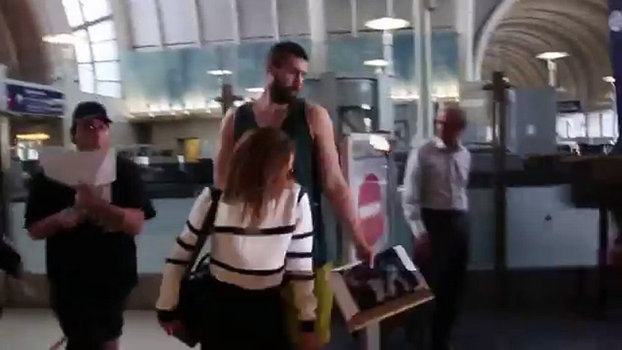 Emma Watson Wears Stripes And Evades Fans At LAX