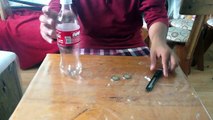 Cómo meter una moneda en una botella - Truco de magia sorprendente