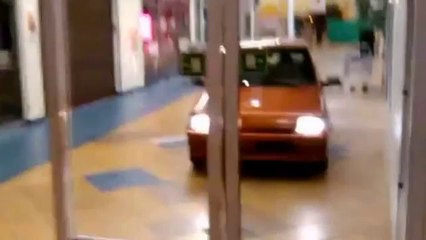 Driving a Car into a Shopping Mall