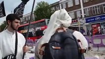 A Group of Mullahs Holding A Rally in UK Demanding Islamic Sharia in Britain