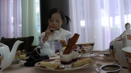 Girl Having Afternoon Tea