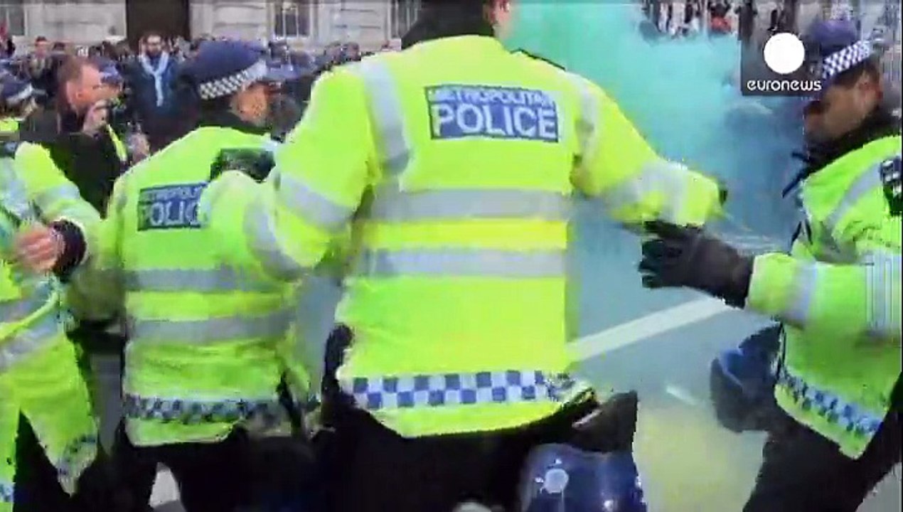 London: anti-Cameron demonstrators clash with riot police