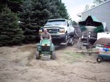John Deere lawn tractor pulls F350 Dually