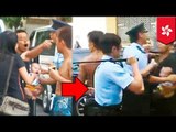 Man uses baby as human shield as he fights police in Hong Kong