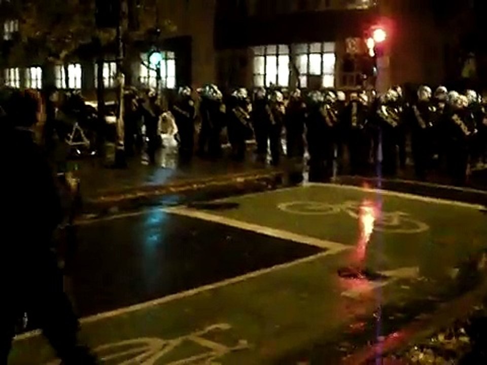 Riot police charge on protesters at McGill University, Montreal, Canada