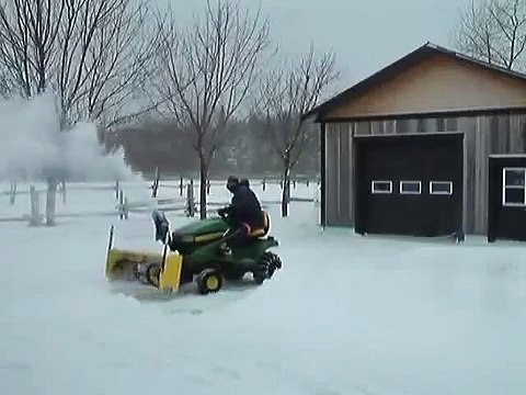 John Deere X300 with 44 snowblower in action