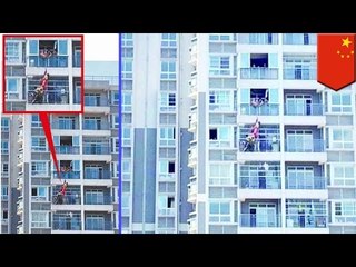 Suicide Attempt: Chinese woman jumps from 12th story, caught by downstairs neighbor