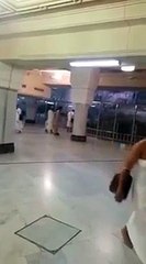 A Man Breaking The Glass Wall Which Is Surrounding The Safa Mountain In Makkah-512x384