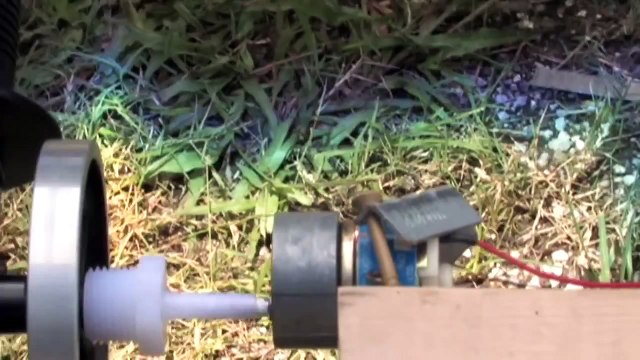 Stirling Hot Air Engine Producing Electrical Current from a Small DC Hack Generator