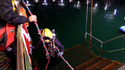 Kirby Morgan helmet diving in a gas holder