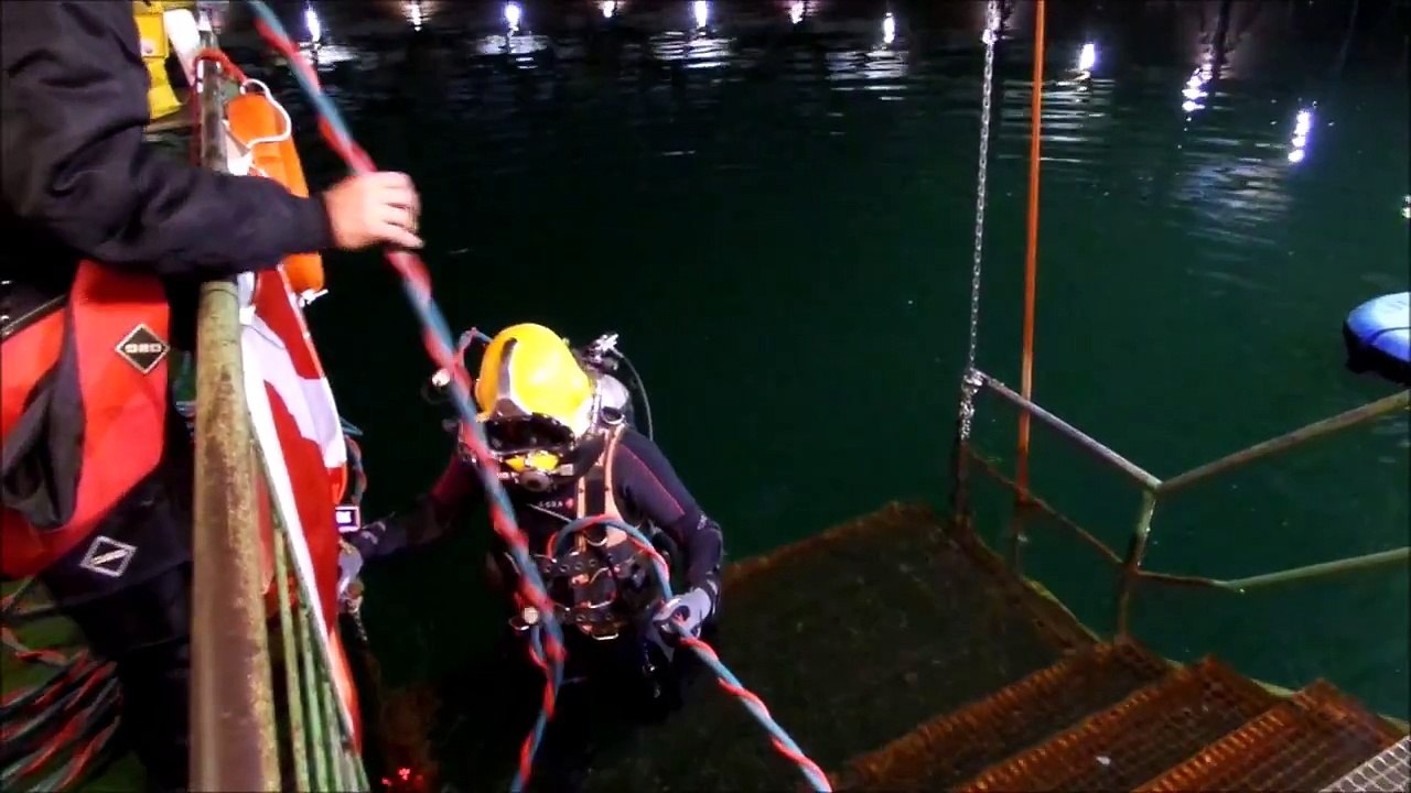 Kirby Morgan helmet diving in a gas holder