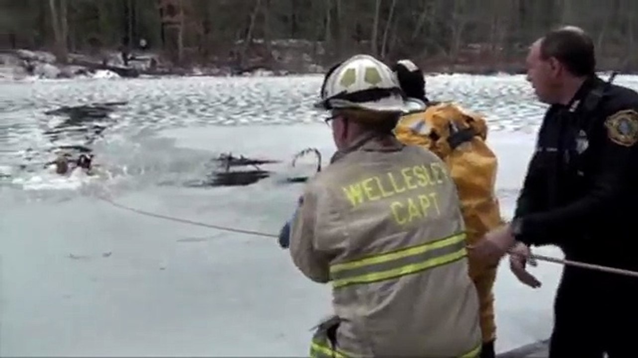 Raw: Firefighters Rescue Family Dog in Icy River