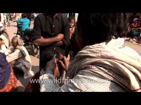 Ear cleaning - a genuine roadside service in India