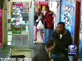 Surveillance Video Captures Robber, Clerk Shootout