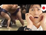 A sumo wrestler's privates nearly exposed while his belt was untied by rival