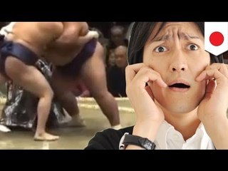 A sumo wrestler's privates nearly exposed while his belt was untied by rival