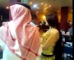Sheikh throwing money on bellly dancer in a UAE Nightclub
