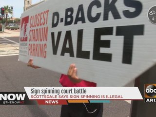 Sign spinning battle going on in Scottsdale