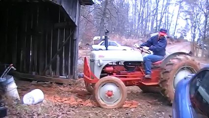 1952 Red Belly Ford Tractor Working In The Mud