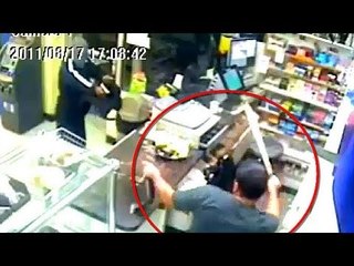 Deli clerk pulls machete on masked man in robbery attempt [REAL FOOTAGE]