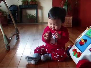 Asian baby choking on apple