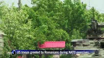 US troops greet Romanian locals during NATO exercises