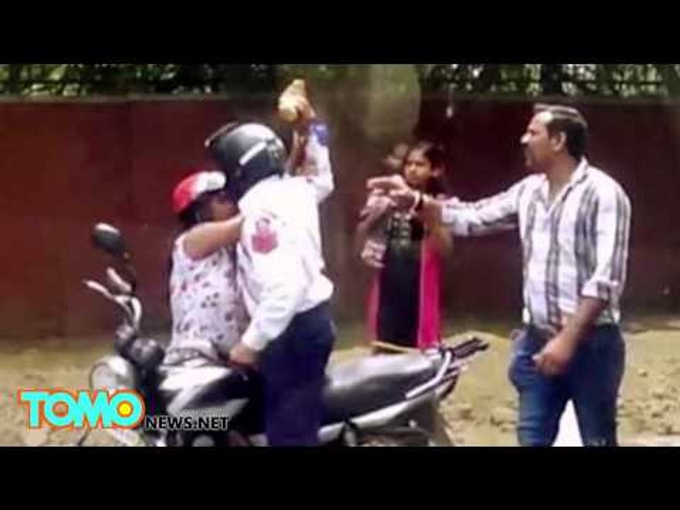 Corrupt cop caught on camera: Officer beats woman who won’t bribe him with brick - TomoNews