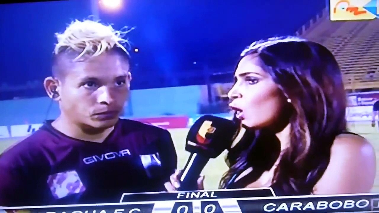 Venezuelan footballer kicked by rival fan during live interview