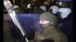 (POLICE MAN SHOUT) In Anty government rioting hits riga latvia BBC NEWS VIDEO