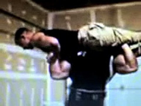Brad Hollibaugh lifting guy overhead
