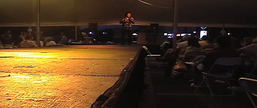 Bill J Brooks chats with the tent crowd at Graceland Crossing Elvis Week 2006