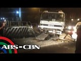 Cement mixer hits concrete barrier in QC