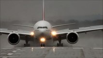 Wet runway! Emirates Boeing 777-300 blowing up the water.