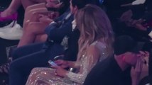 Jennifer Lopez Scrolls Through Phone During Mariah Carey Performance