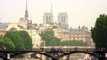 Royalty Free Stock Footage of Pedestrian bridge over the Seine with Paris skyline in the background.