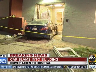 Car slams into building in Phoenix
