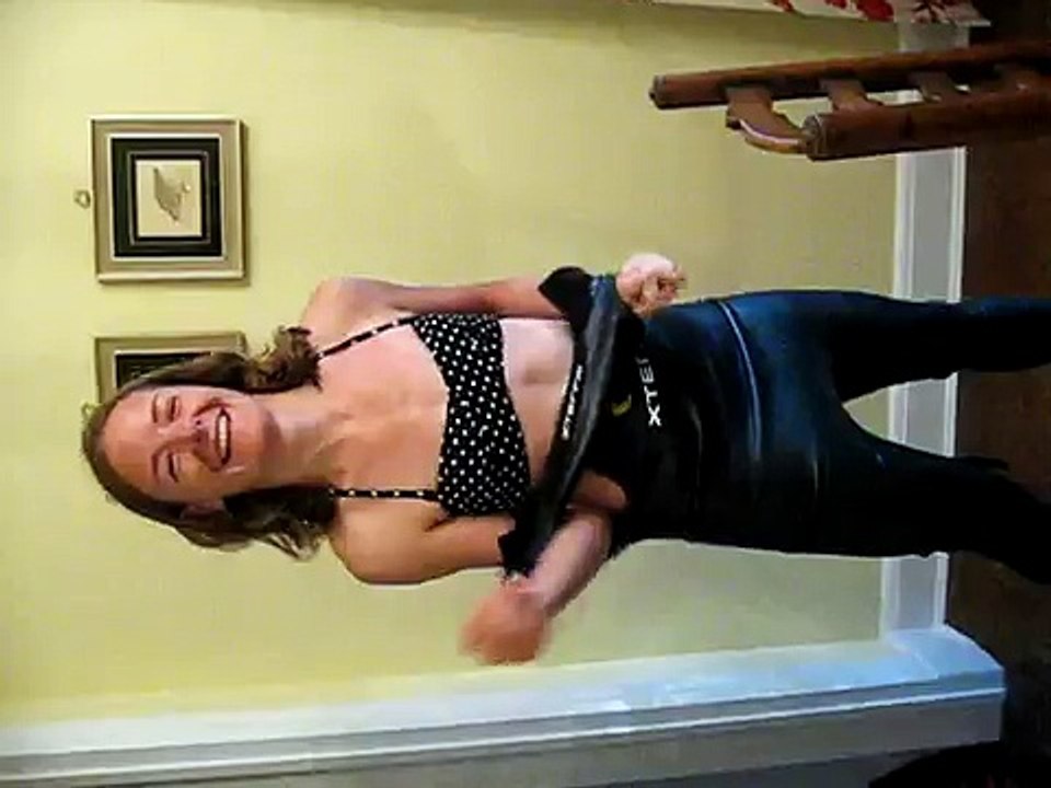 Jess getting into XS wetsuit