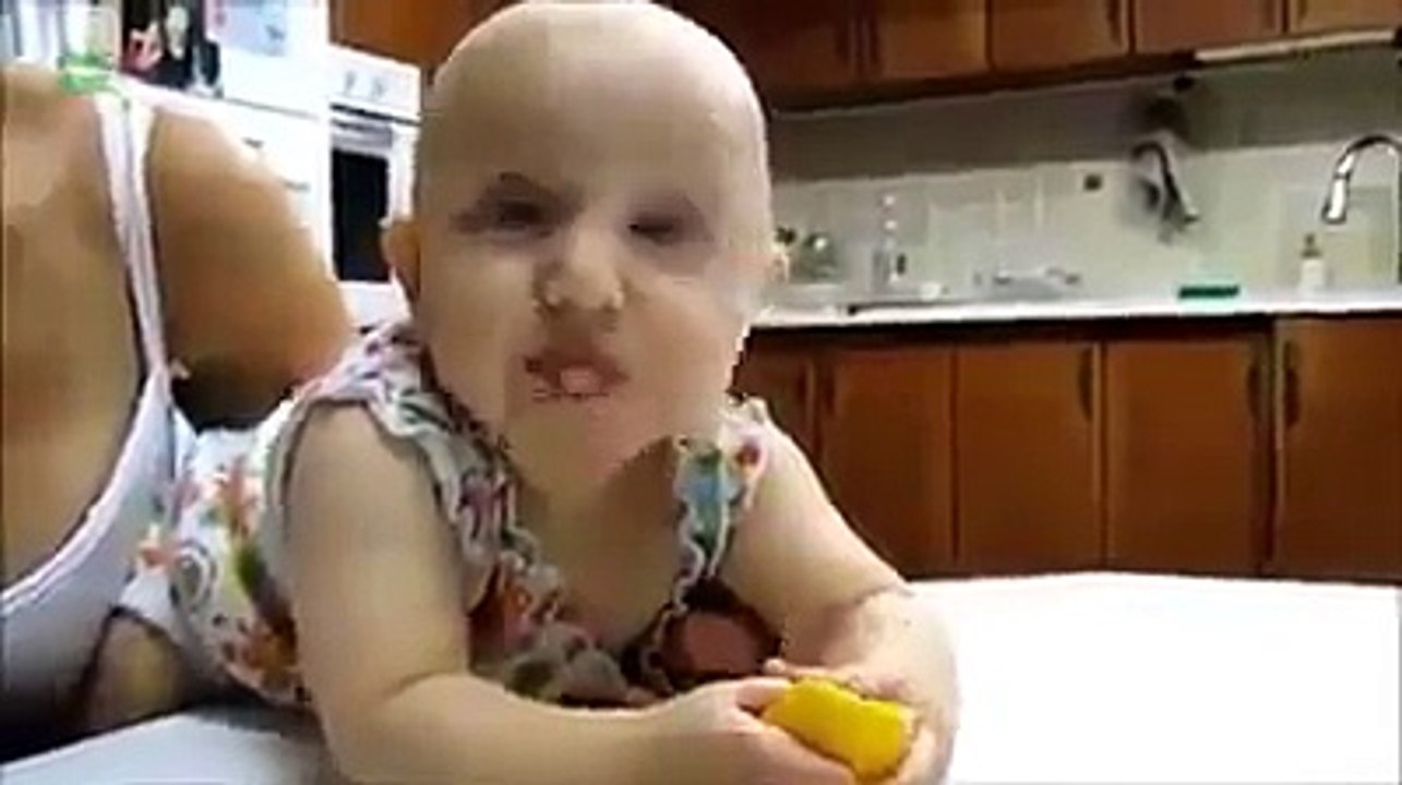 Children Eating Lemon First Time