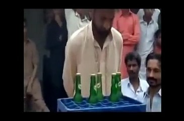 Pakistani Man Open 5 Bottles with his Teeth and Drink Them in 1 Minute
