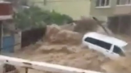 Flood turns streets into rivers, tossing around cars