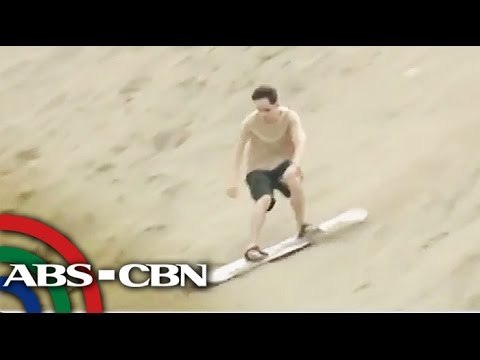 Thrill-seekers take on 3-storey sand dunes in Ilocos