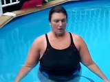 Female Escape Artist Underwater Breath Hold While Lifting Weights