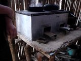 Cooking with corn cobs on Cedesol rocket stove