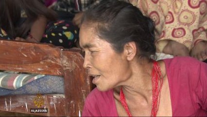 One month after quake, Nepali families try to repair lives