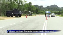Checkpoints erected after graves found near Thai border