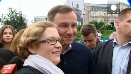 Poland's new president Duda serves public - quite literally
